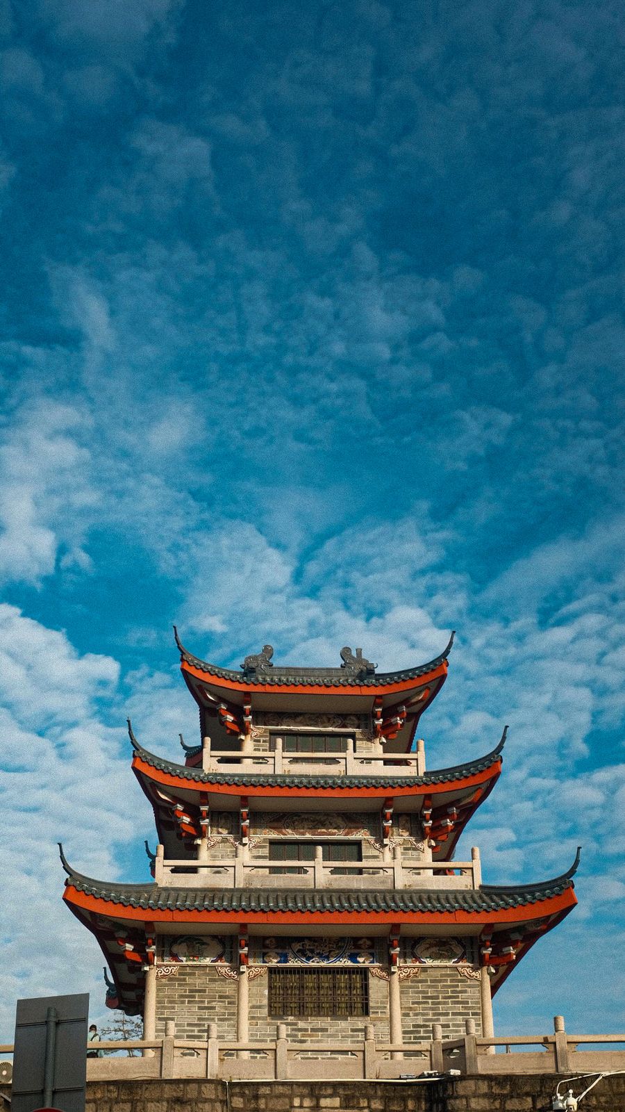 A pagoda against a deep blue sky in Hong Kong